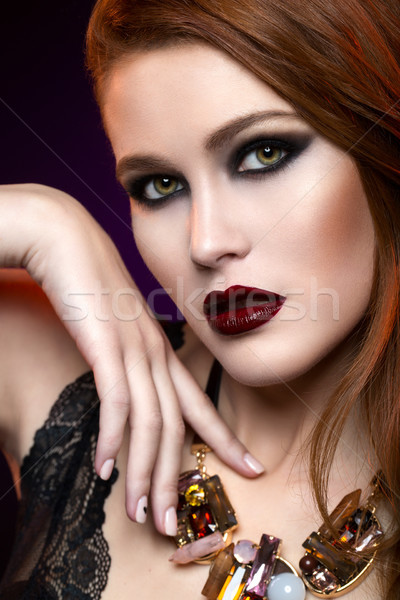beautiful girl with bright makeup and red hair Stock photo © svetography