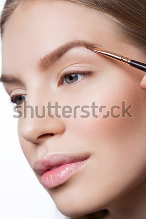 Stock photo: Woman correcting eyebrows form