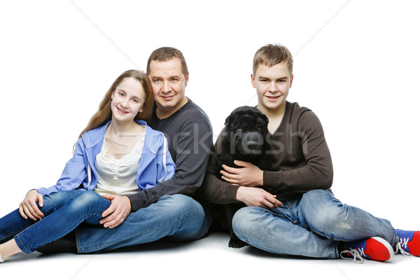 Baba çocuklar oturma köpek aile portre genç Stok fotoğraf © svetography