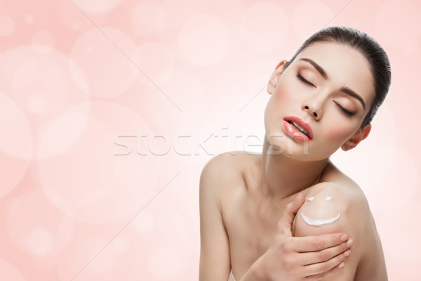 Girl with cream on skin Stock photo © svetography