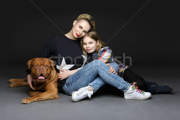 Girls with big brown dog Stock photo © svetography