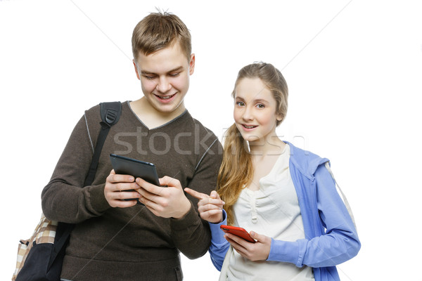 Teen boy and girl standing with mobile phones Stock photo © svetography