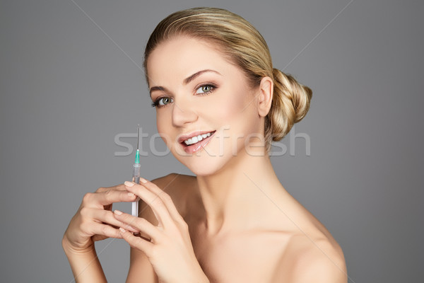 美麗的姑娘 注射器 美麗 快樂 年輕女子 商業照片 © svetography