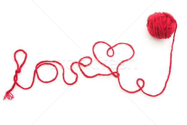 Lână fir cuvant dragoste scris roşu Imagine de stoc © svetography