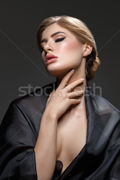 Beautiful girl with cat eye make-up Stock photo © svetography