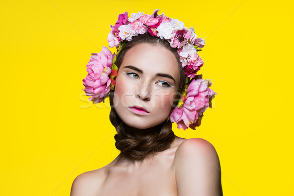 Stock photo: Beautiful girl with floral headphones