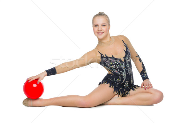 Güzel jimnastikçi kız kırmızı top kostüm Stok fotoğraf © svetography