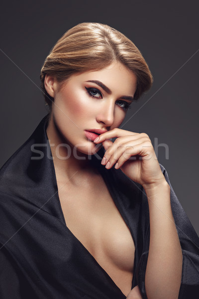 Beautiful girl with cat eye make-up Stock photo © svetography