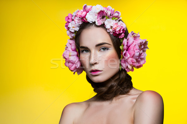 Stock photo: Beautiful girl with floral headphones