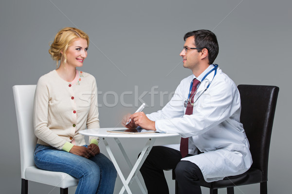 Vrouw arts afspraak knap witte jas Stockfoto © svetography