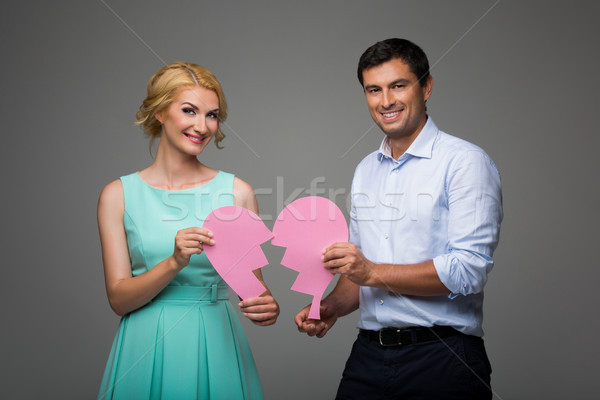 Beautiful couple holding pink broken heart Stock photo © svetography