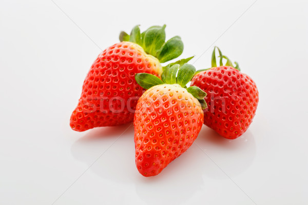 Closeup of not fully ripe strawberries Stock photo © svetography