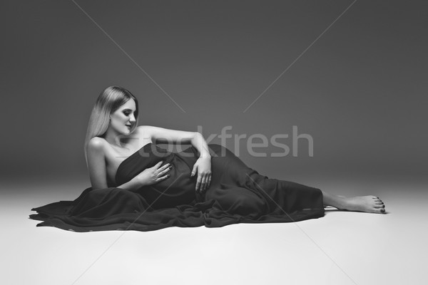 Pregnant girl in red dress Stock photo © svetography
