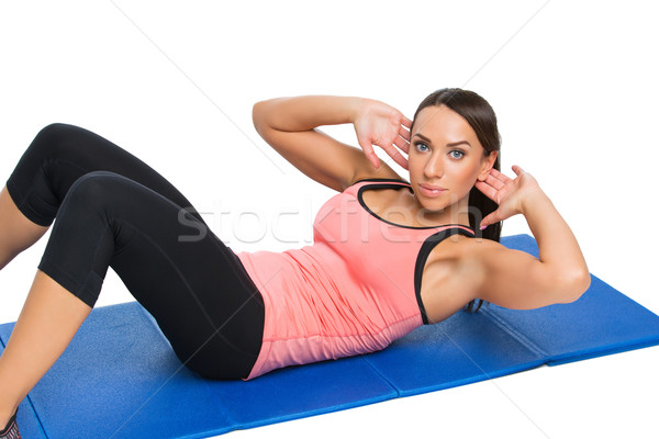 Beautiful woman making sport exercise Stock photo © svetography