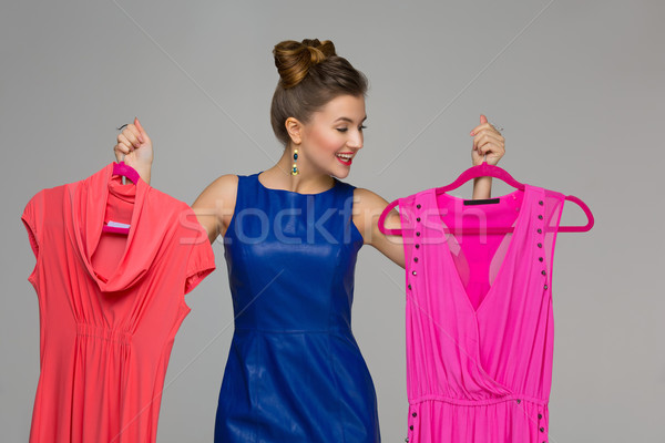 Happy girl with dresses Stock photo © svetography