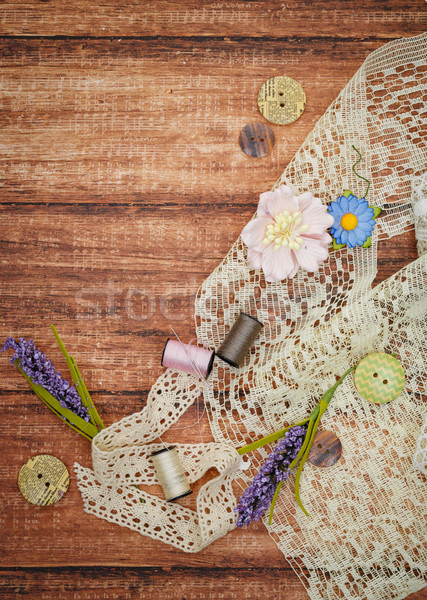 Lace and thread on wooden background Stock photo © svetography