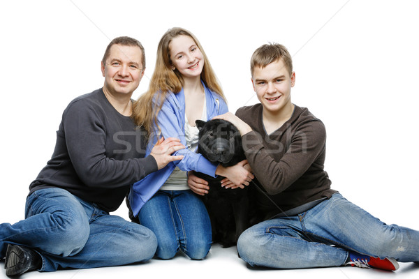 Baba çocuklar oturma köpek aile portre genç Stok fotoğraf © svetography