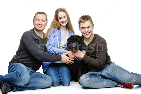 Baba çocuklar oturma köpek aile portre genç Stok fotoğraf © svetography