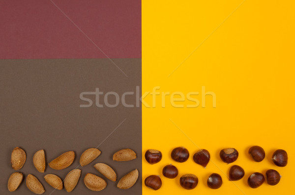 Stock photo: Hard shell nuts on split background