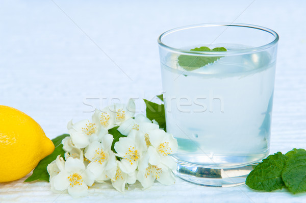 Lemonade with fresh lemon and mint leaves with copy space Stock photo © szabiphotography