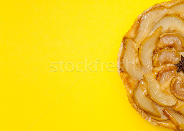 Tarte Tatin apple pear tart isolated on yellow background Stock photo © szabiphotography