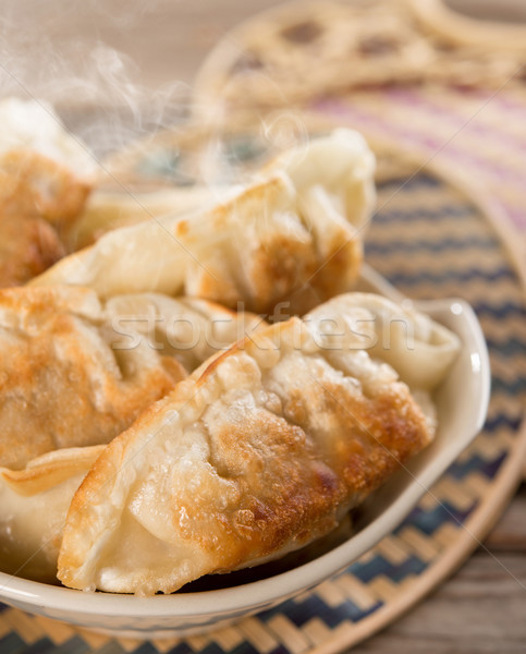 Famous Asian cuisine pan fried dumplings Stock photo © szefei