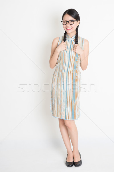 Asian Chinese girl in traditional cheongsam  Stock photo © szefei