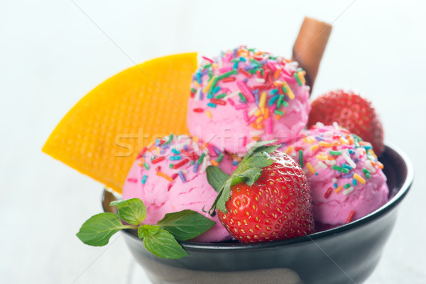 Pink ice cream with fruits close up Stock photo © szefei