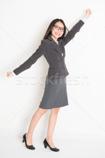 Asian businesswoman arm grabbing something Stock photo © szefei