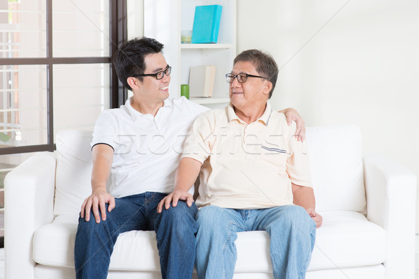 Father and son having conversation  Stock photo © szefei