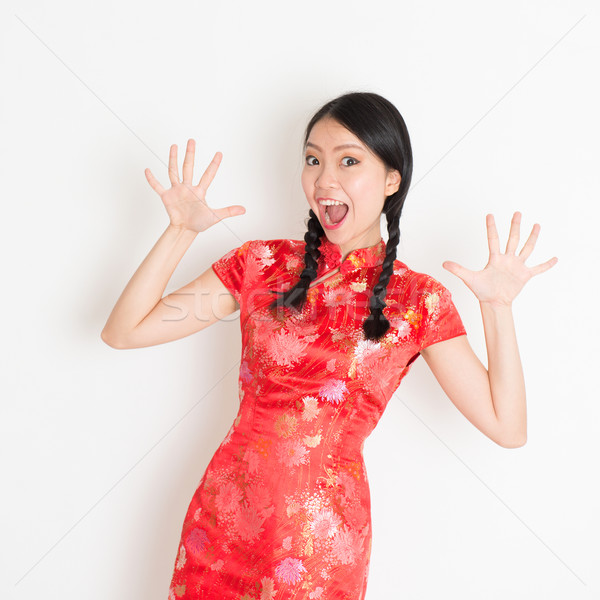 Shacked Asian chinese girl  Stock photo © szefei