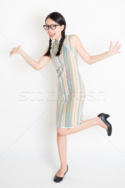 Excited Asian girl jumping around Stock photo © szefei