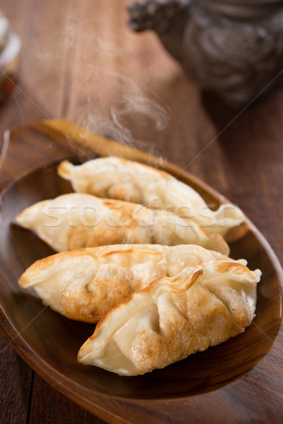 Fresh pan fried dumplings Stock photo © szefei