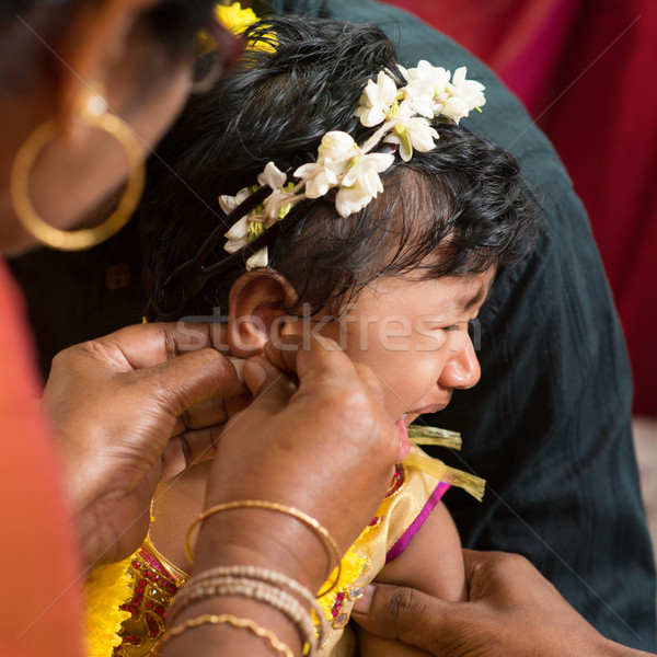 Traditional Hindu having ear piercing ceremony Stock photo © szefei