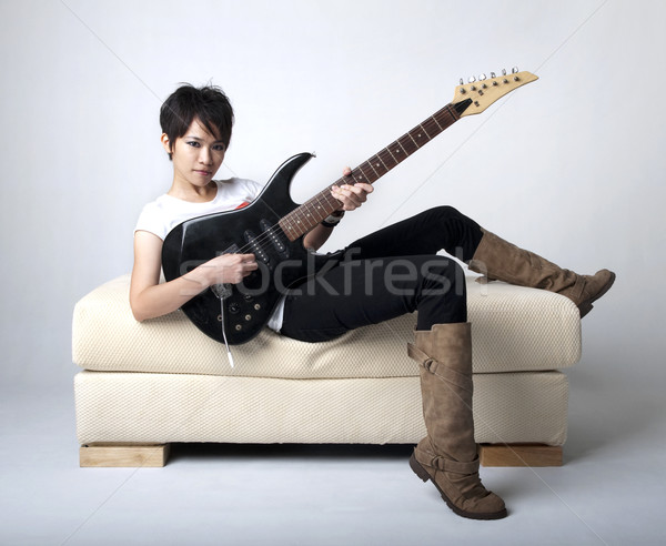 Punk gitaar vergadering sofa Stockfoto © szefei