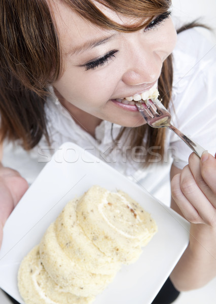 Genieten cake jonge asian vrouw Stockfoto © szefei