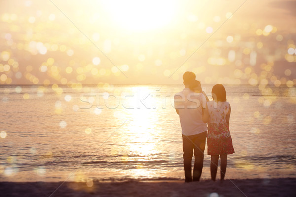 Stock photo: Family enjoying sunset view at coastline