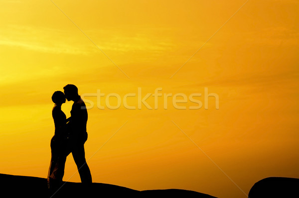Csók naplemente sziluett pár fény fiú Stock fotó © szefei