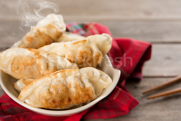 Popular Asian meal pan fried dumplings Stock photo © szefei