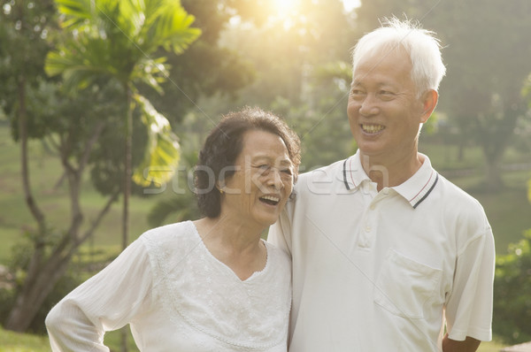Asian seniors couple at outdoor park Stock photo © szefei