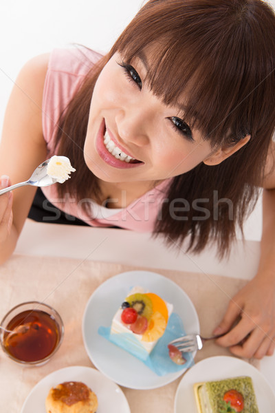 Eating cake. Stock photo © szefei