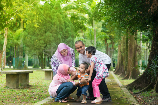 Asian family playing outdoor  Stock photo © szefei