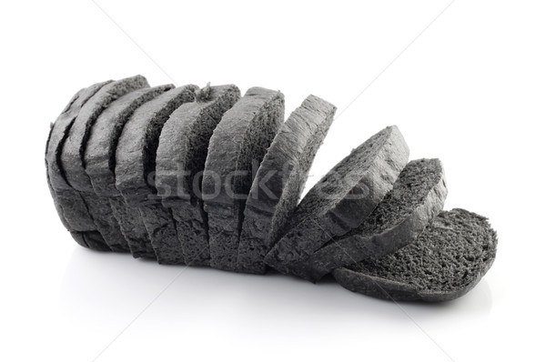 Czarny węgiel drzewny chleba cięcia bochenek odizolowany Zdjęcia stock © szefei