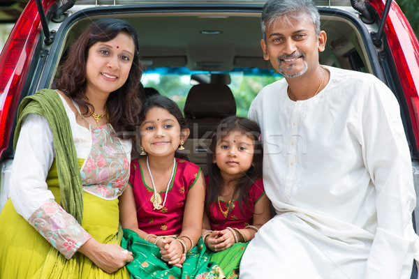 Indian family sitting in car. Stock photo © szefei