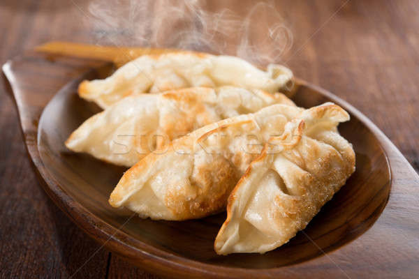 Fresh fried dumplings Stock photo © szefei