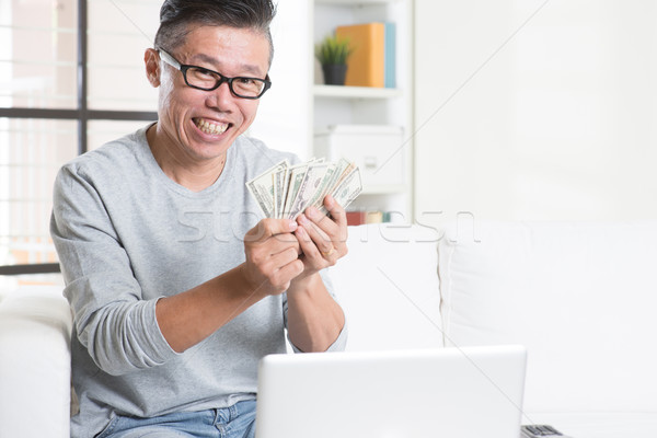 Earning money from online business Stock photo © szefei