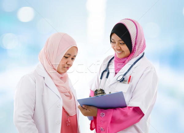 Two Southeast Asian Muslim medical doctor Stock photo © szefei