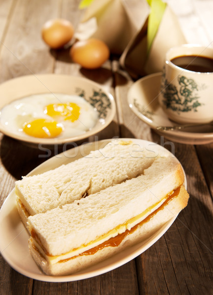Traditional Malaysian breakfast kaya butter toast and coffee Stock photo © szefei