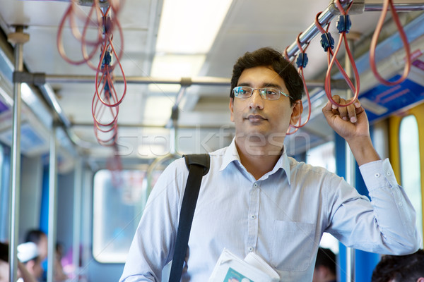 Stock photo: Indian businessman inside train.