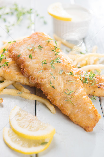 Fish fillet with french fries Stock photo © szefei